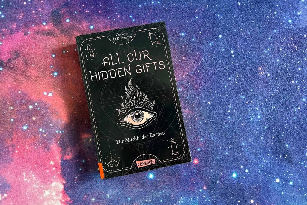 Das Bild zeigt das Buch "All our Hidden Gifts" auf einem Universumshintergrund. Dieses Buch wird im Blogartikel vorgestellt.